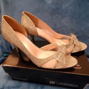 Silver heels, synthetic material.